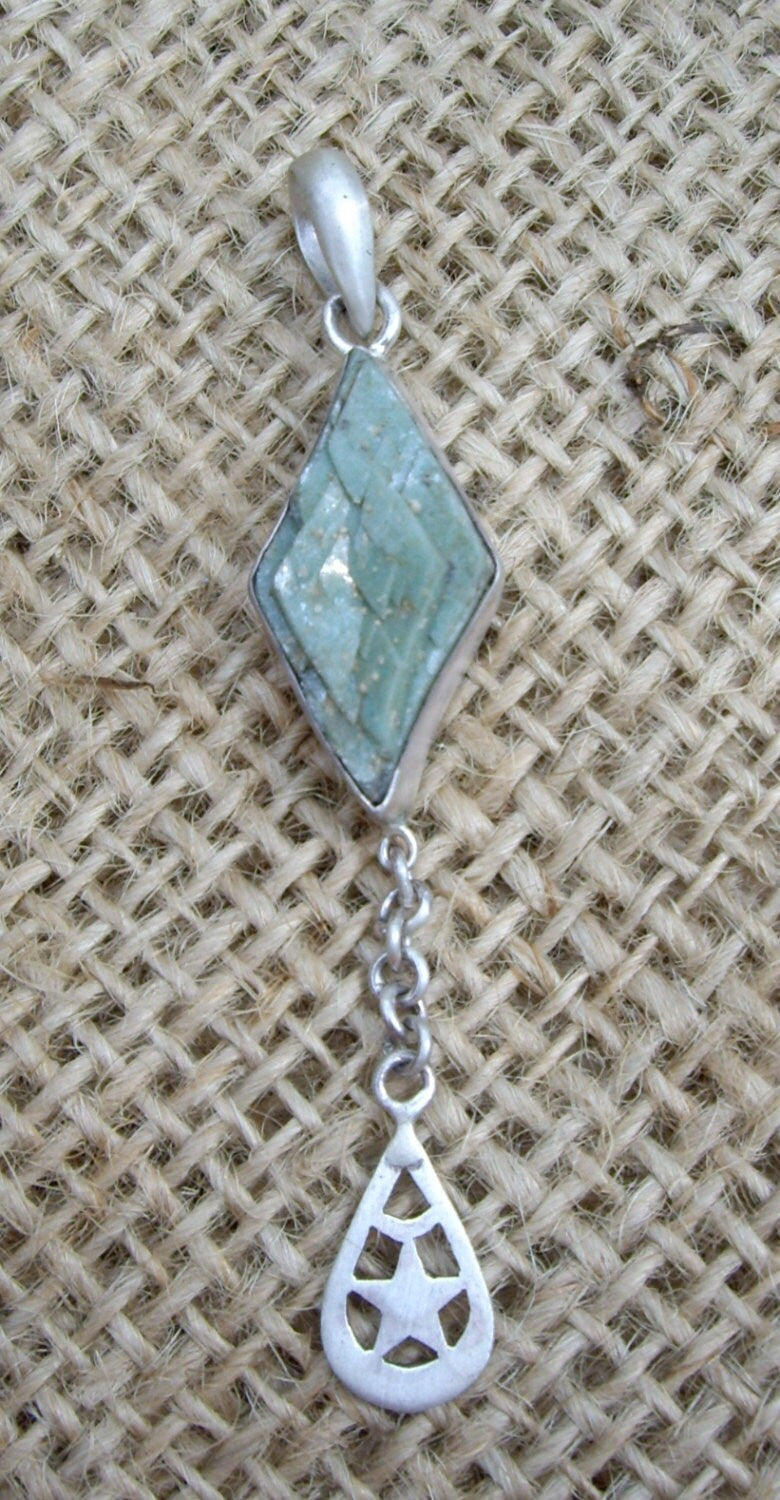 Pendants - Dolomite stones clasped in Silver